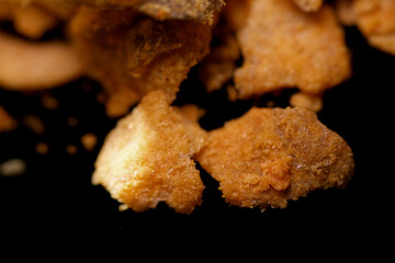 Close up texture of crispy fried salmon skin coated with salted egg powder