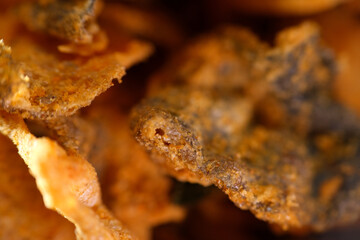 Close up texture of crispy fried salmon skin coated with salted egg powder