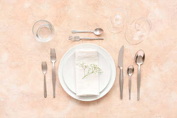 Stylish table setting on beige background. Top view