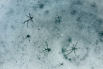 Fantastic ice shapes on a frozen lake looking like the surface of the moon or ice art