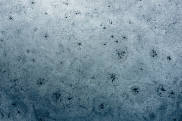 Fantastic ice shapes on a frozen lake looking like the surface of the moon or ice art