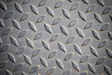 Patterned steel surface and rust.