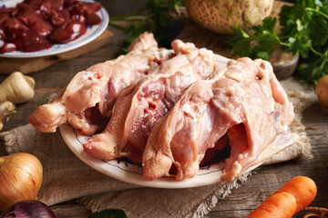Chicken backs, liver and fresh vegetables - Ingredients for preparing bone broth or soup