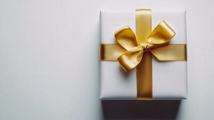 elegant present wrapped in a shiny gold ribbon