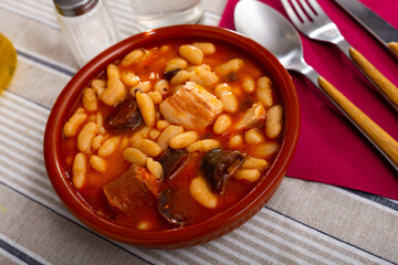 Traditional dish of Asturian cuisine Fabada, beans stewed with pork, blood sausage and chorizo served in clayware
