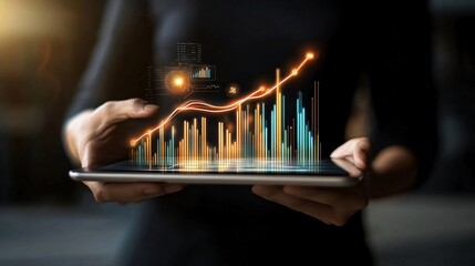 Woman analyzing growth charts on tablet