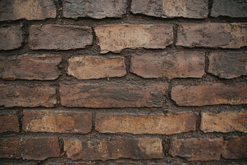 Fototapeta premium A brick wall with a rough texture and a few cracks