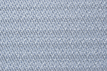 A surface of perforated metal filter of a cooker hood close up