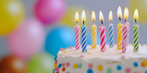 Birthday Cake with Colorful Candles and Party Balloons
