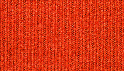 Red wool chunky jersey fabric texture as background