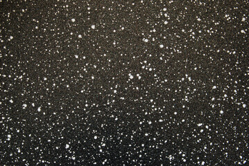 Black spotted texture, black ceramic chips texture as background