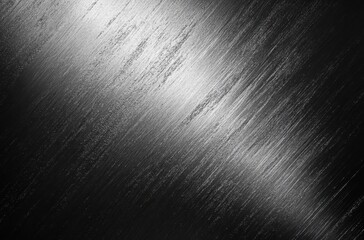 Abstract textural background of brushed metal with soft reflections, dark tones, and dynamic light patterns for artistic and industrial design uses