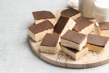 Delicious puffed rice bars on gray textured table, closeup