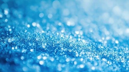 A soft blue background with faint circular highlights, resembling a bokeh effect.