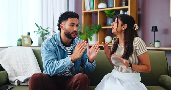 Frustrated couple, fight or argument with disagreement on sofa for conflict or cheating affair at home. People, separation or toxic relationship with emotion for breakup, divorce or dispute at house
