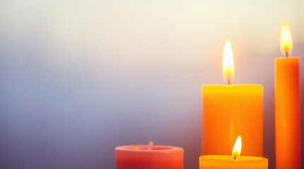 three burning candles on gradient background
