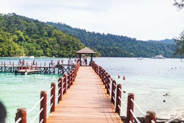 Wooden Pier Leading to Tropical Island Paradise, Malaysia