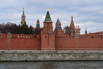 Obraz premium Petrovskaya, Spasskaya and Nabatnaya towers of the Moscow Kremlin and the domes of the Cathedral of the Intercession of the Blessed Virgin Mary (St. Basil's Cathedral), Moscow, Russia