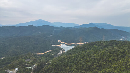 Fototapeta premium View of Lush Forested Mountains and Serene Reservoir Dec 24 2024