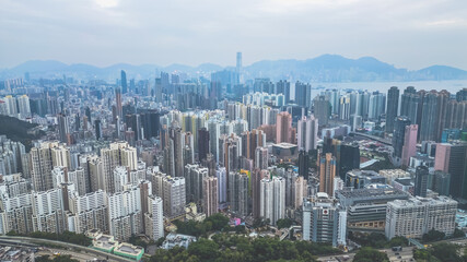 Fototapeta premium Urban Cityscape with Skyscrapers under a Cloudy Sky Dec 24 2024