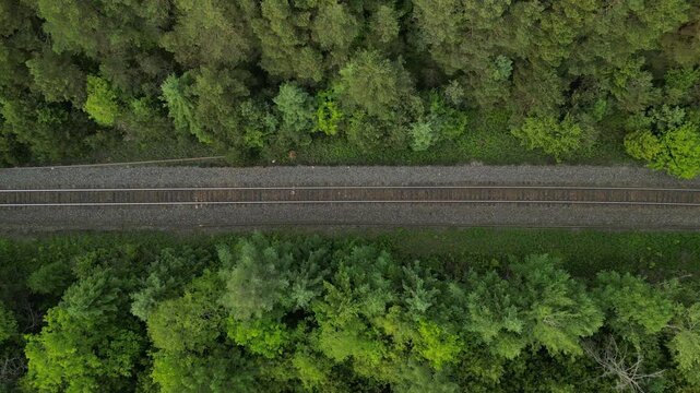 Vertical travelling view of a railway track in a forest - Vue verticale a&eacute;rienne en travelling d'une voie de chemin de fer dans une for&ecirc;t