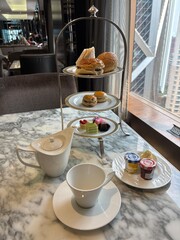tea time with delicious cakes and sandwiches