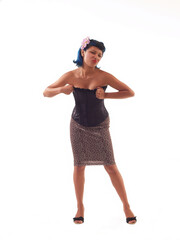 Young Hispanic Woman Making Face Pulling Up On Corset