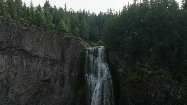 Breathtaking 4K aerial footage of Salt Creek Falls, Oregon's second-highest waterfall at 286 feet, surrounded by lush evergreen forests in Lane County. Captured in October.