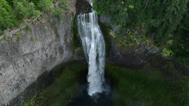 Breathtaking 4K aerial footage of Salt Creek Falls, Oregon's second-highest waterfall at 286 feet, surrounded by lush evergreen forests in Lane County. Captured in October.