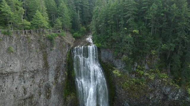 Breathtaking 4K aerial footage of Salt Creek Falls, Oregon's second-highest waterfall at 286 feet, surrounded by lush evergreen forests in Lane County. Captured in October.