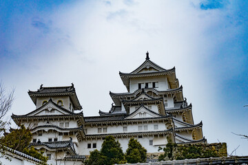 Himeji Castle in Japan under blue sky and white clouds