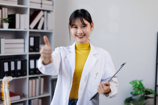 Portrait of happy asian female doctor wearing medical uniform and stethoscope at hospital.Beautiful smiling young asian woman doctor work.
