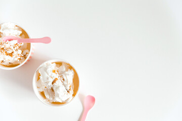 Ice cream boxes and cute pink spoons. White background. Mockup for design, template with copy space, flat lay