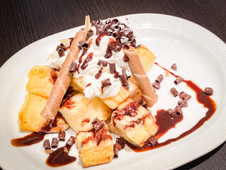 Decadent Dessert with Whipped Cream and Chocolate Garnish