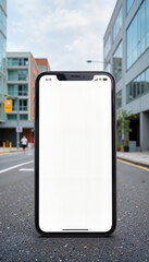 Smartphone mockup displaying blank screen in urban setting, creativity