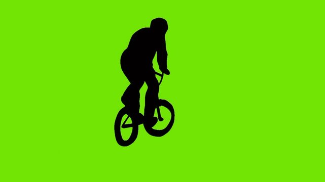 silhouette animation of boy showing off freestyle trick with bicycle green background