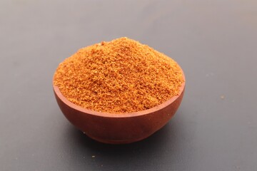 Palm sugar, or brown sugar, or kawung sugar (Arenga pinnata), close up, on a black background.