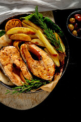 Grilled salmon with potato in menu..