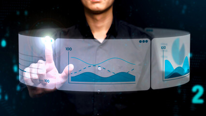 A person uses biometric authentication with a fingerprint scan, overlaid with futuristic digital data visualizations, including graphs and analytics in a high-tech interface.