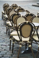 Dijon, France - October 2, 2024:  Chairs of a restaurant in Dijon, France