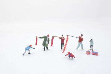 a Miniature Figures Celebrating Festivities with Decorations