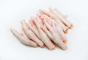 Raw chicken feet isolated on white background.