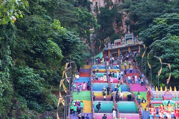 25 ‎June ‎2024 Kuala Lumpur , Malaysia the Batu Caves' rainbow stairs, showing people ascending...