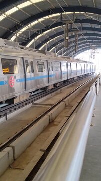New Delhi, India, August 12 2024 - Delhi Metro train arriving at Jhandewalan metro station in New Delhi, India, Asia, Public Metro departing from Jhandewalan station