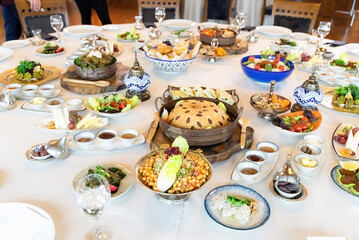 Turkish style Ramadan Iftar table. Delicious dinner with various appetizers, starters, salads and...