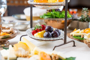 Classic Turkish breakfast in luxury restaurant. Detail shot of fruits and nuts. Close up view.