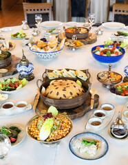 Turkish style Ramadan Iftar table. Delicious dinner with various appetizers, starters, salads and main courses.Turkiye.