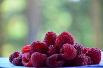 Raspberry. Sweet red raspberries. Juicy raspberries on the table. Fresh Raspberries. Rubus idaeus....