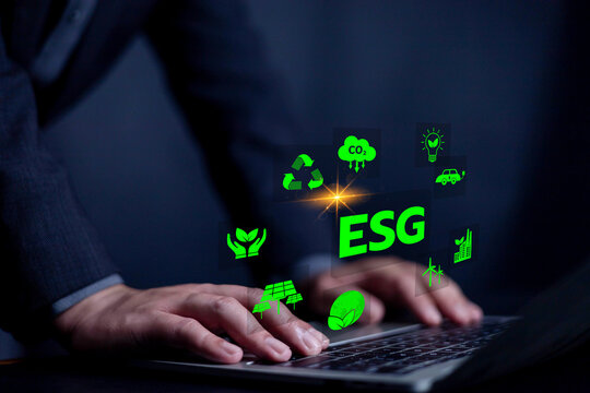 ESG Concepts on environment, Natural environment, Displays icons in front of businessman's laptop, Businessman uses laptop with analyze investment sustainability ESG and corporation development. - Powered by Adobe