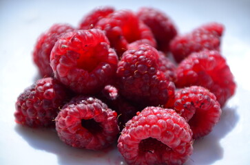 Raspberry. Sweet red raspberries. Juicy raspberries on the table. Fresh Raspberries. Rubus idaeus....